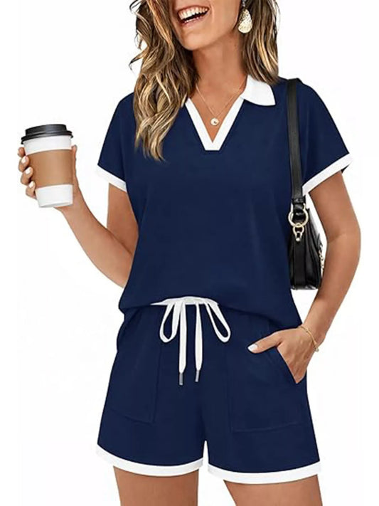 Navy polo-collar short sleeve top and matching drawstring shorts set with white trim