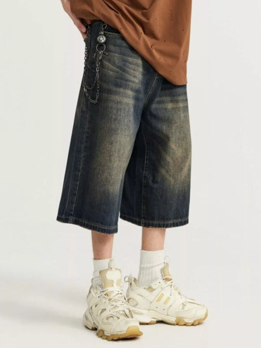 Washed wide-leg denim shorts in light-medium blue, wide leg with button closure