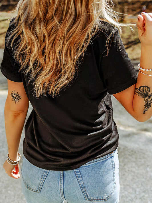Black crewneck T-shirt, rear view, with pumpkin patches