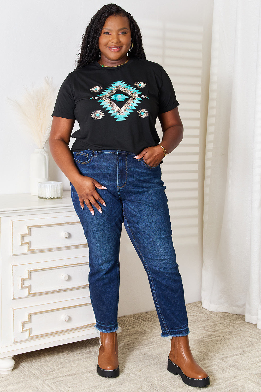 Black short-sleeve T-shirt with turquoise and gold diamond graphic on front