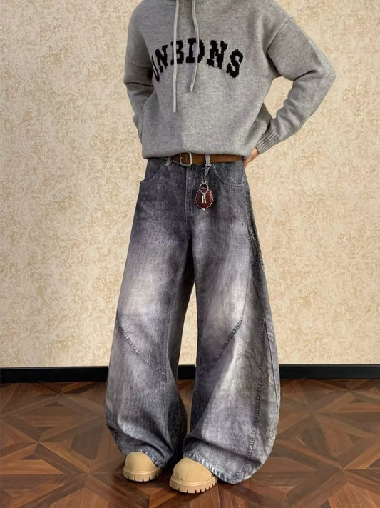 Vintage-wash wide-leg jeans in dark gray denim, belt loops and flared legs