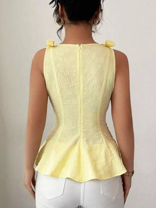 Yellow bow-shoulder peplum tank, back view with center seam and flared peplum hem