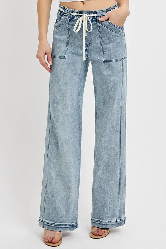 Medium wash straight-leg jeans with drawstring waist, belt loops, and front pockets