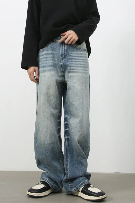 Light wash wide-leg jeans with front pockets and a loose, wide fit