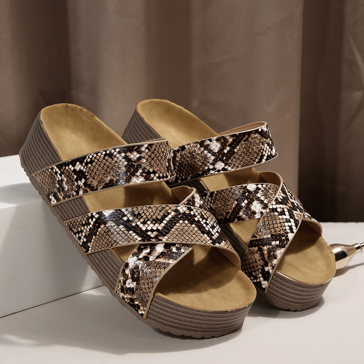 Snake-pattern platform sandals with braided crisscross straps and open toe, brown and beige