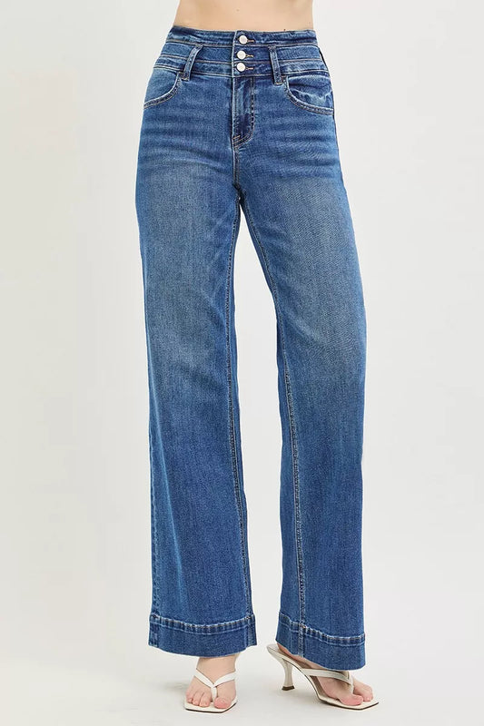 High-rise wide-leg jeans, dark blue denim with side seam stitching and button closure.