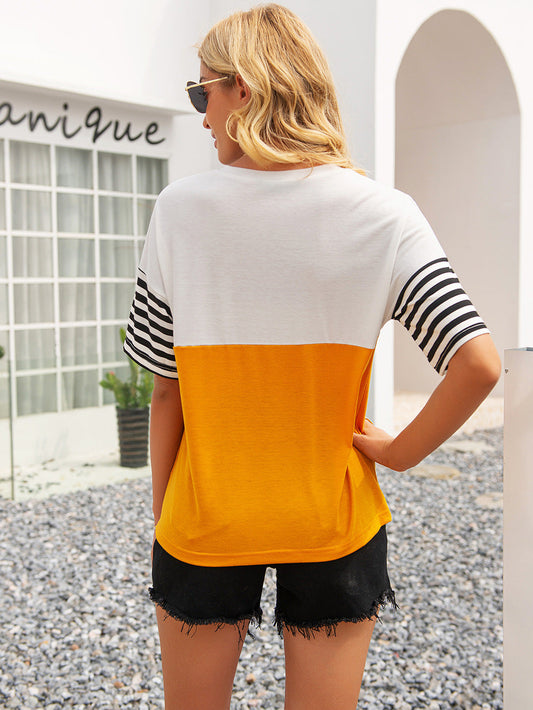 Color block round neck tee back view, white and tangerine with striped sleeves.