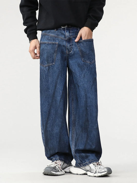 Washed blue wide-leg baggy jeans with flap front pockets and zipper fly