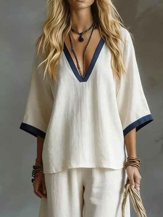 White V-neck top and wide-leg pants set with contrast blue neck and sleeve trim