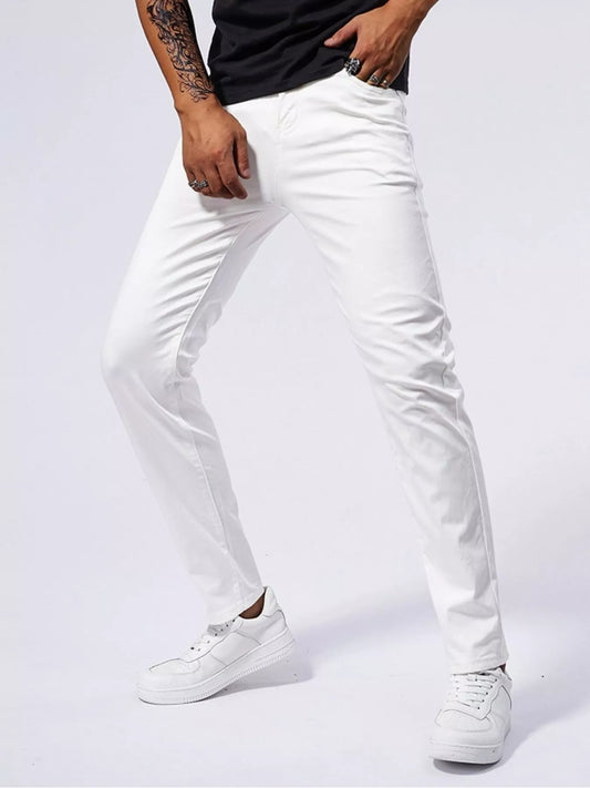Slim-fit white jeans, side view with tapered legs and stitched seams