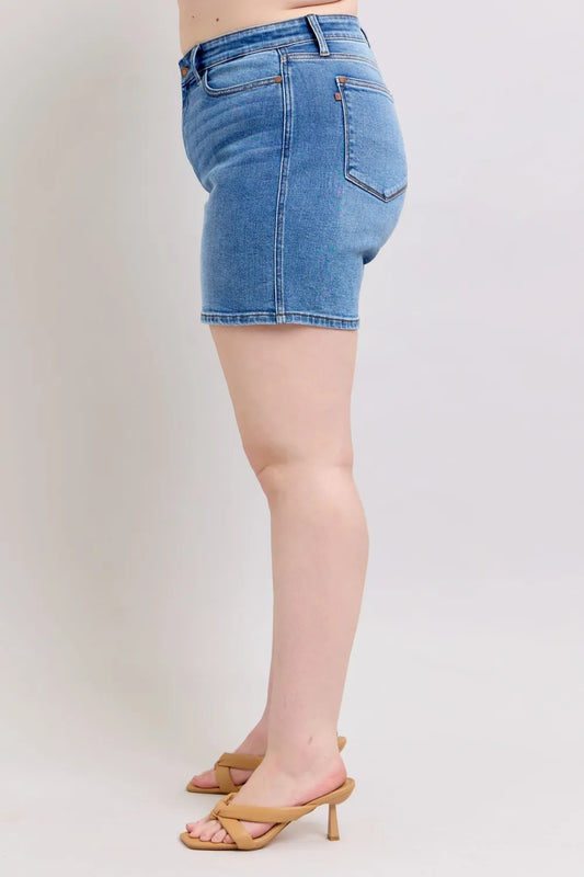 Medium-wash denim shorts with two-button closure and back pocket detail