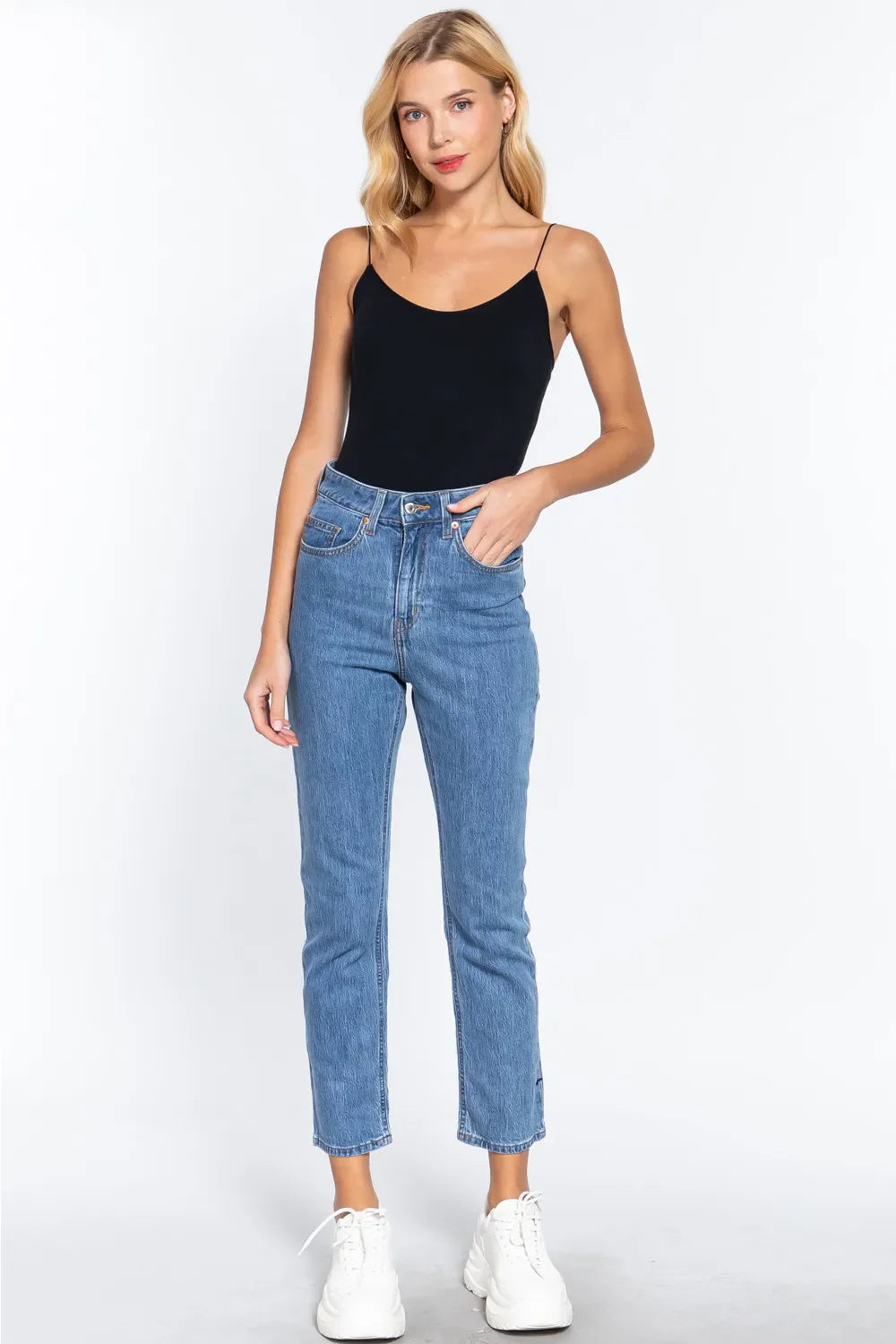 Black seamless cami bodysuit worn with high-rise jeans