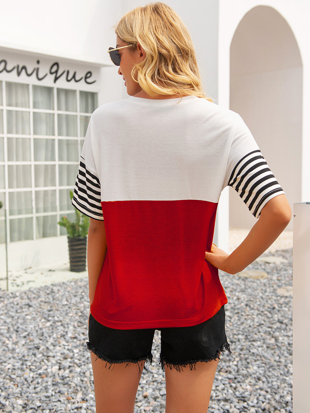 Color block round neck tee back view, white with deep red panel and striped sleeves.