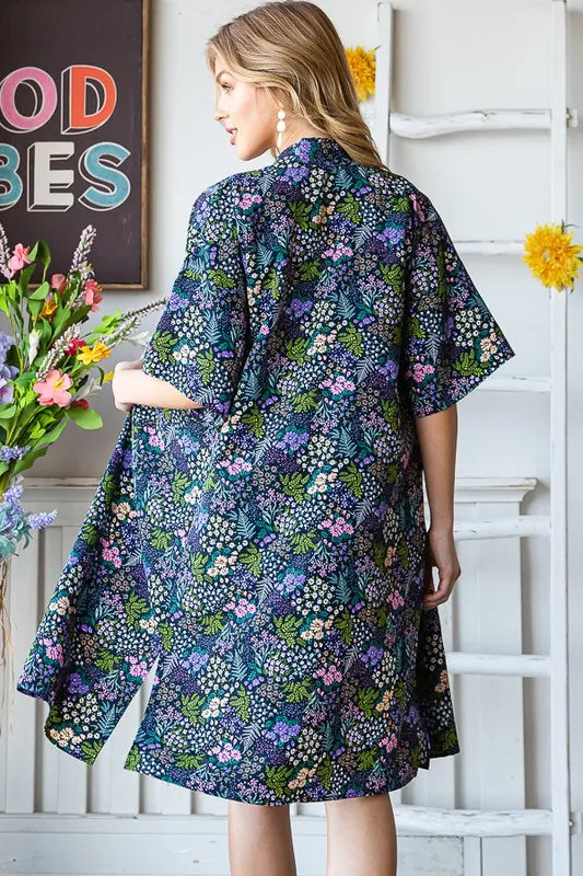 Navy floral open cardigan, half sleeves, straight mid-thigh length with draped back
