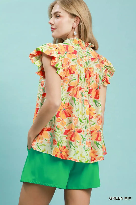 Floral blouse with smocked yoke and ruffle sleeves, light green with orange-red bloom print