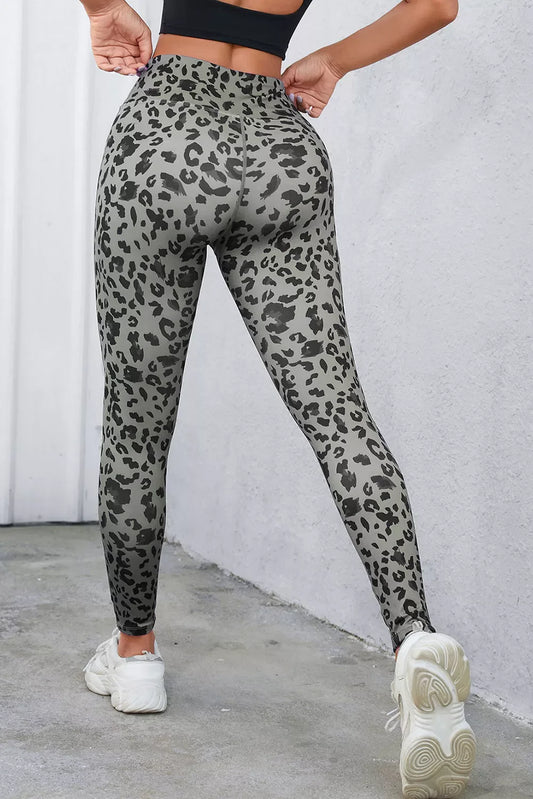 Leopard-print wide waistband leggings in dark gray with black spots, front side view