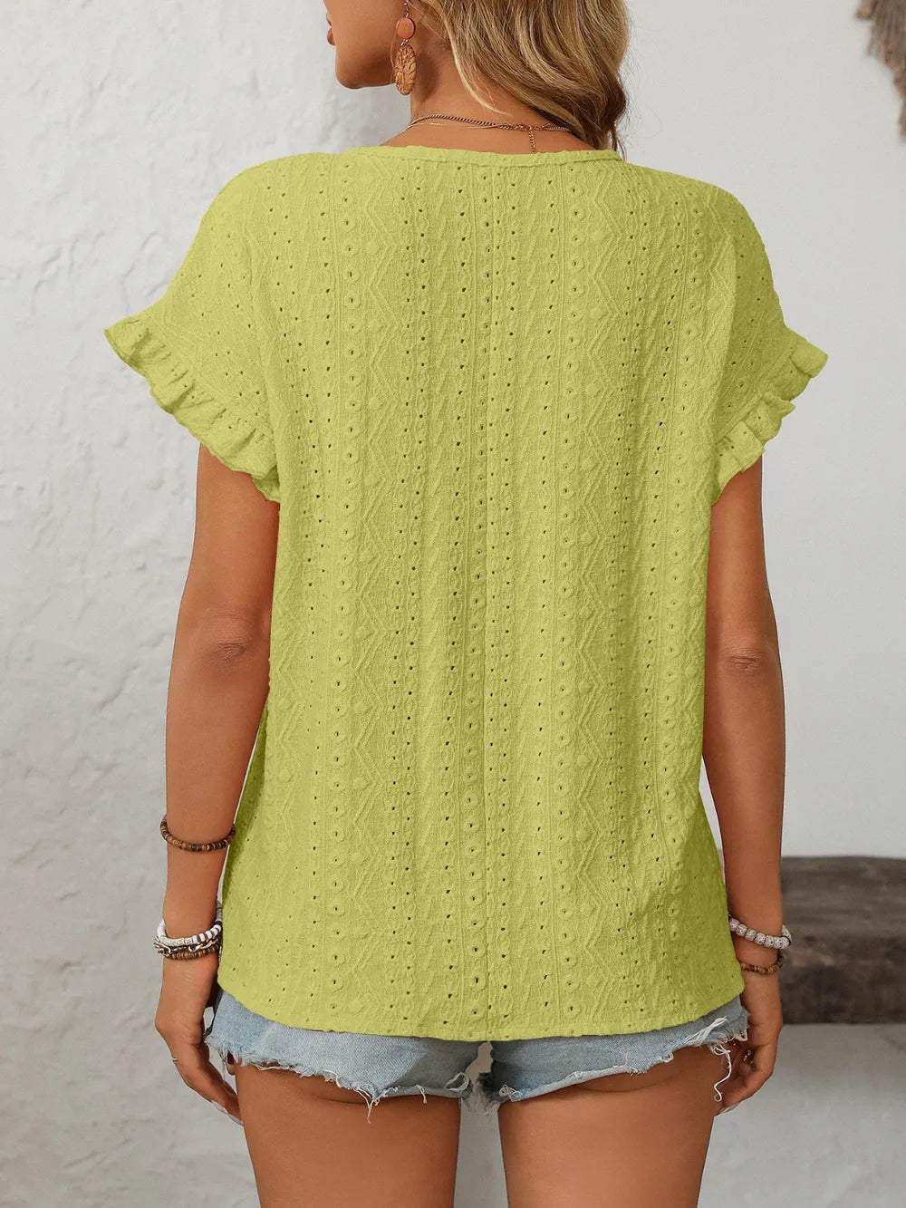 Light lime eyelet round-neck short-sleeve top, back view, with embroidered eyelet pattern