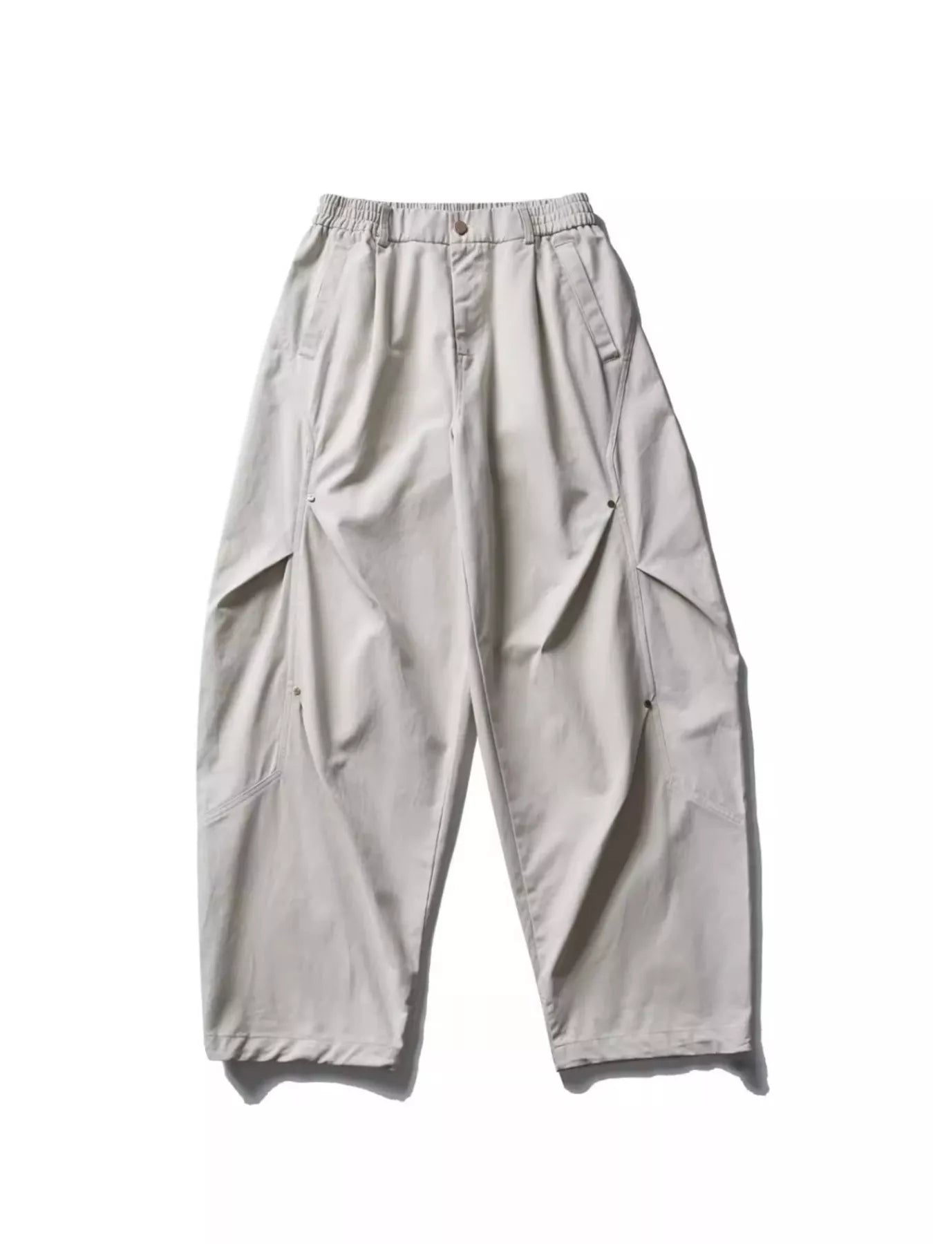 Light gray loose-fit cargo pants with elastic waistband and side flap pockets