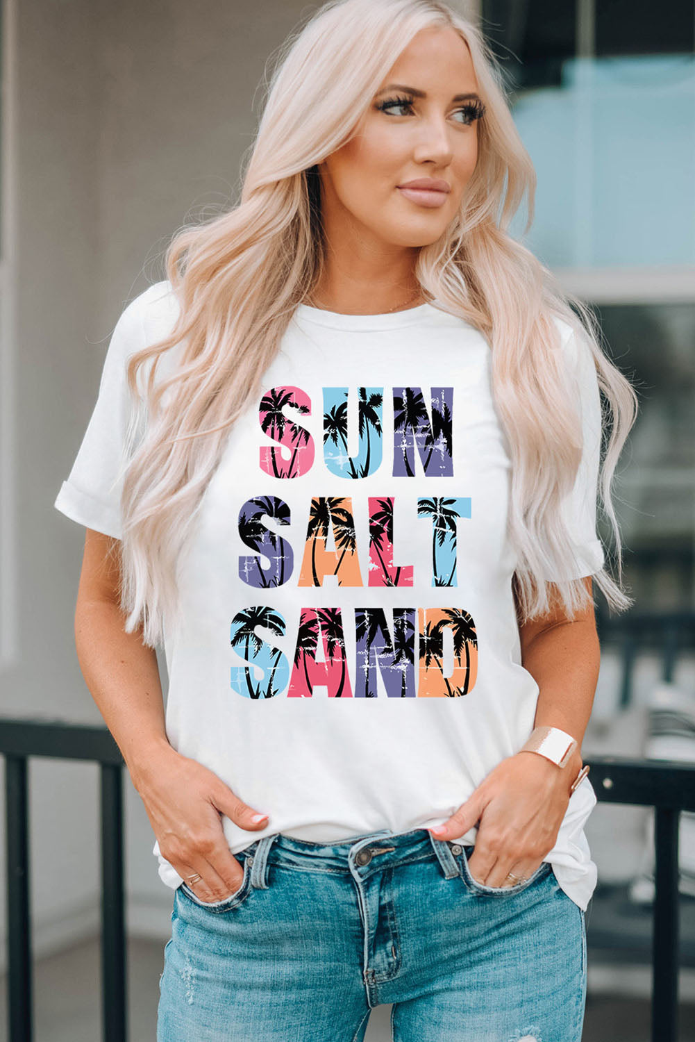 White round-neck T-shirt with colorful letter graphic across the chest