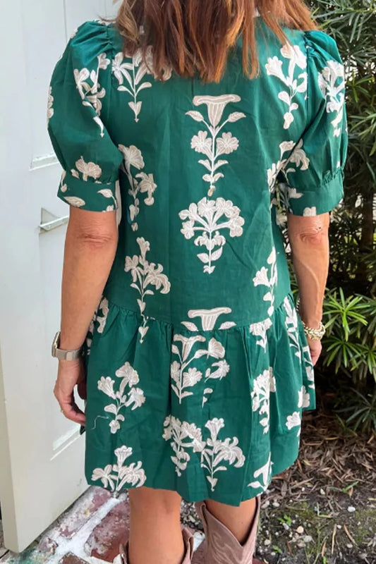 Turquoise floral mini dress with back button detail and puff short sleeves
