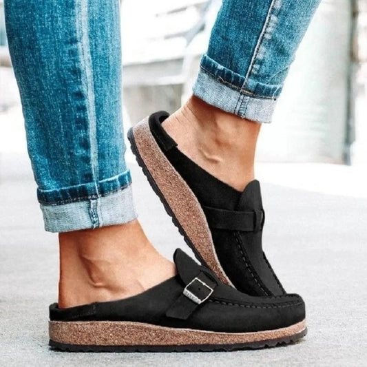 Round toe low heel buckle loafers in black suede with buckle strap and cork-style sole