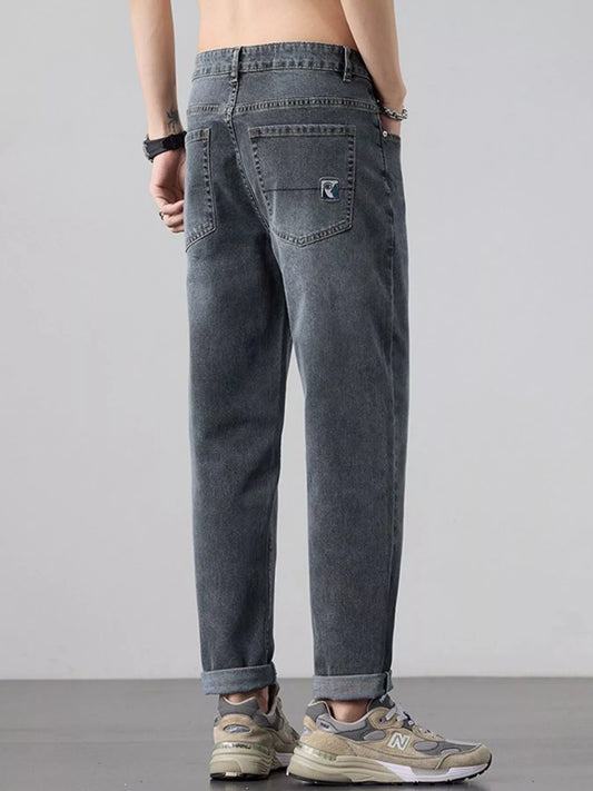 Men's wash straight-leg jeans, blue-gray denim with back pockets and logo patch