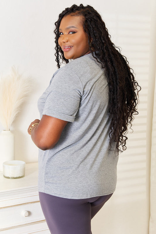Gray cuffed short-sleeve t-shirt with white heart graphic, side view