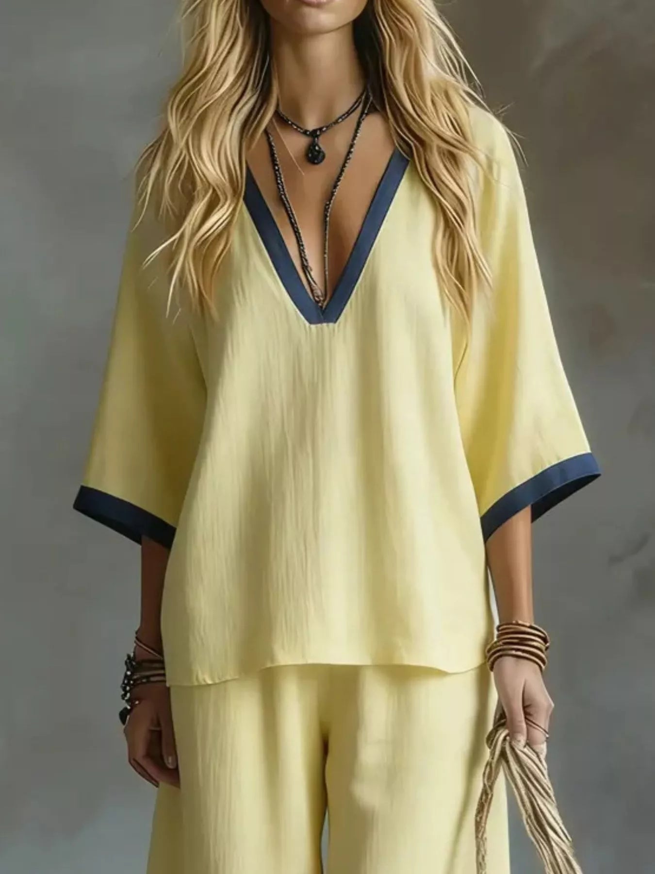 Yellow V-neck top and wide-leg pants set with contrast blue neck trim and sleeve cuffs