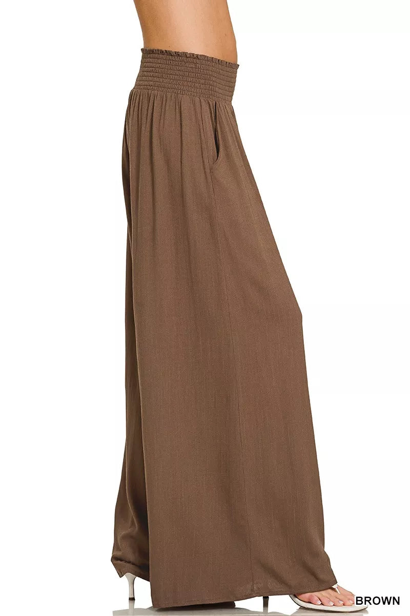 Brown smocked-waist wide-leg lounge pants, full-length with gathered elastic waistband