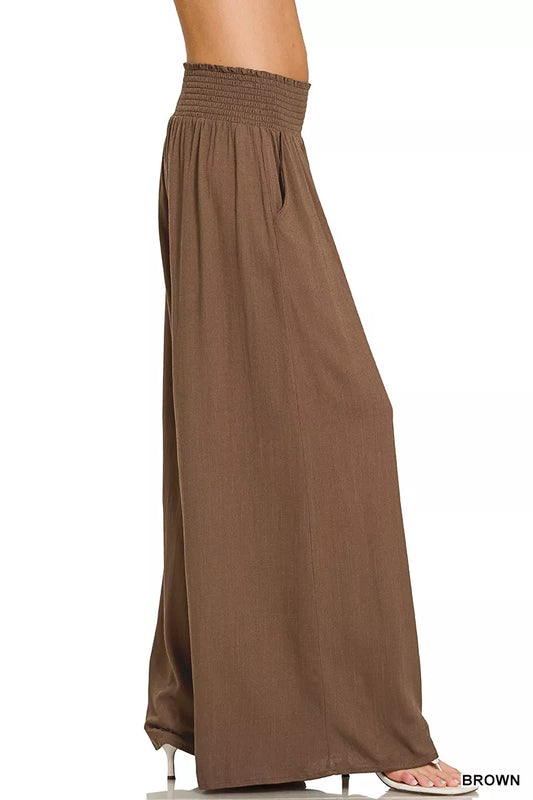 Brown smocked-waist wide-leg lounge pants, full-length with gathered elastic waistband