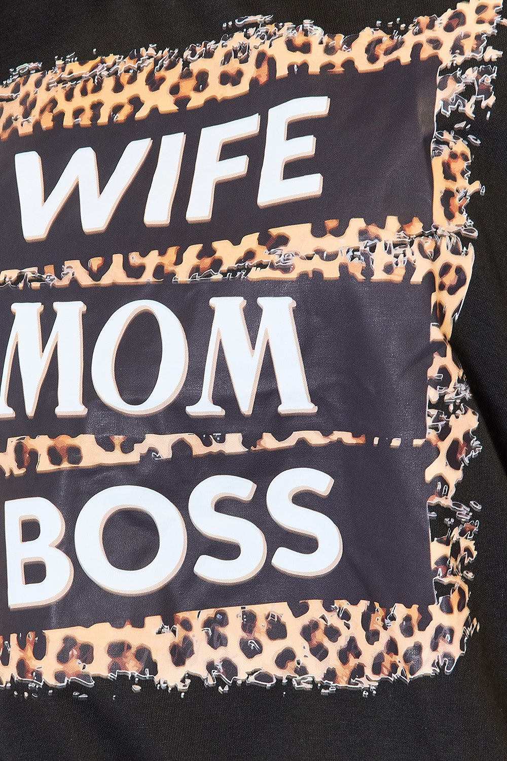 Close-up: leopard-print “WIFE MOM BOSS” graphic on black T-shirt
