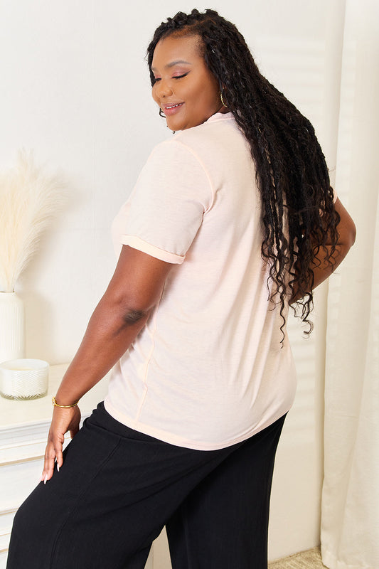 Watermelon pink graphic round-neck T-shirt, side view, black script front print