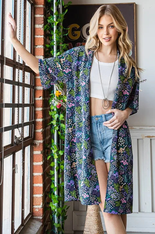 Navy floral open cardigan with half sleeves, open front, standing pose