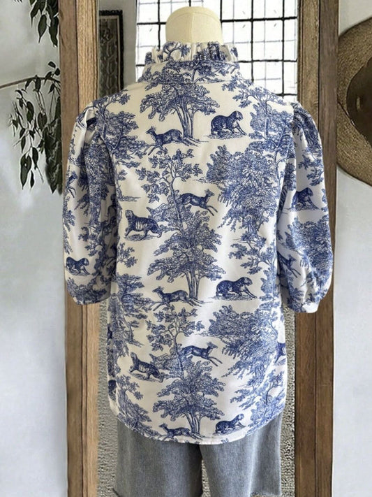 Back view of light indigo printed half-sleeve blouse, round neckline