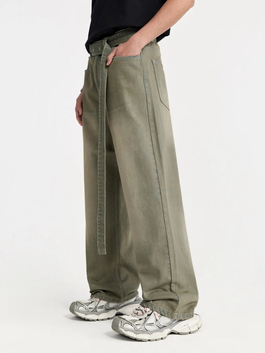Wide-leg jeans in olive green with side seam detail and long loose leg.