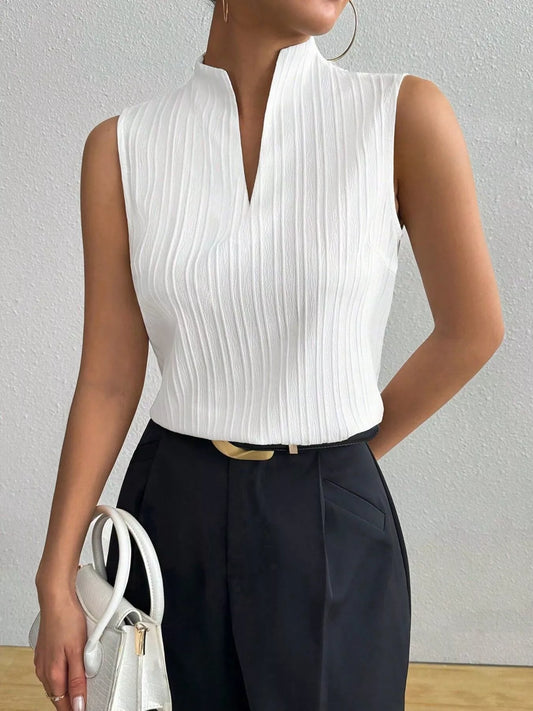 White notched sleeveless top with V-neck, vertical textured stripes