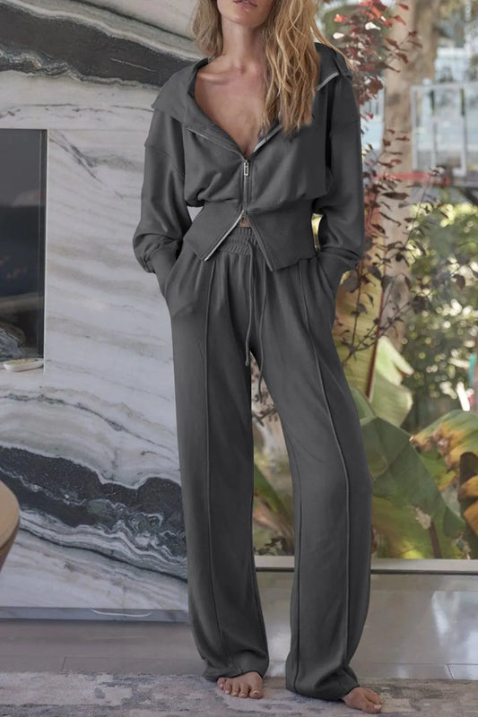 Dark gray zip-up hoodie and matching jogger pants set with hood and elastic waistband