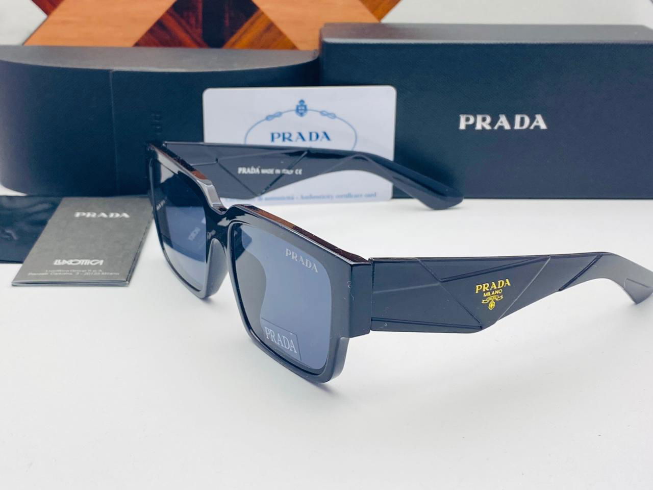 Prada Sunglasses with triangle logo - Wearluxurys