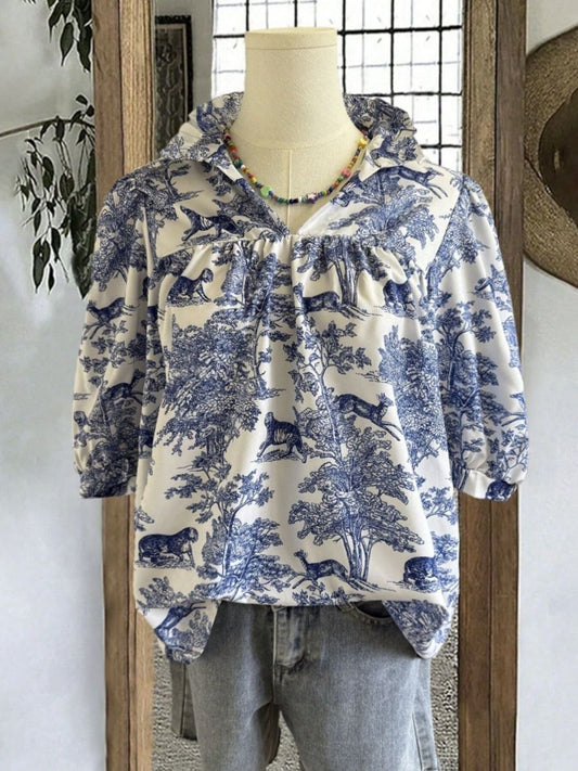 Light indigo toile-print half-sleeve blouse with ruffled neckline