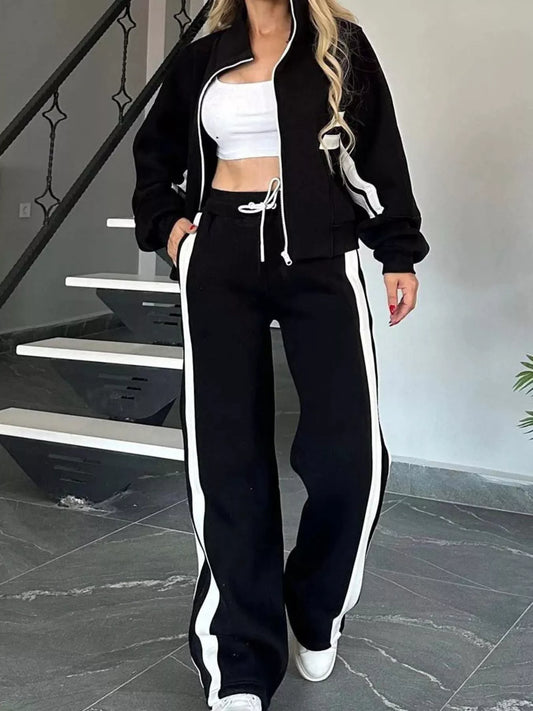 Black zip-up jacket and pants set with white contrast stripe and white drawstring