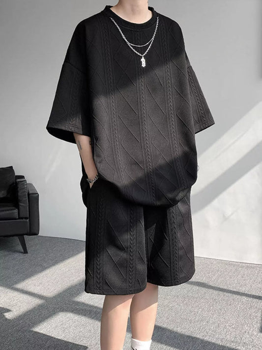 Black textured relaxed-fit top with matching shorts set, short sleeves, loose fit